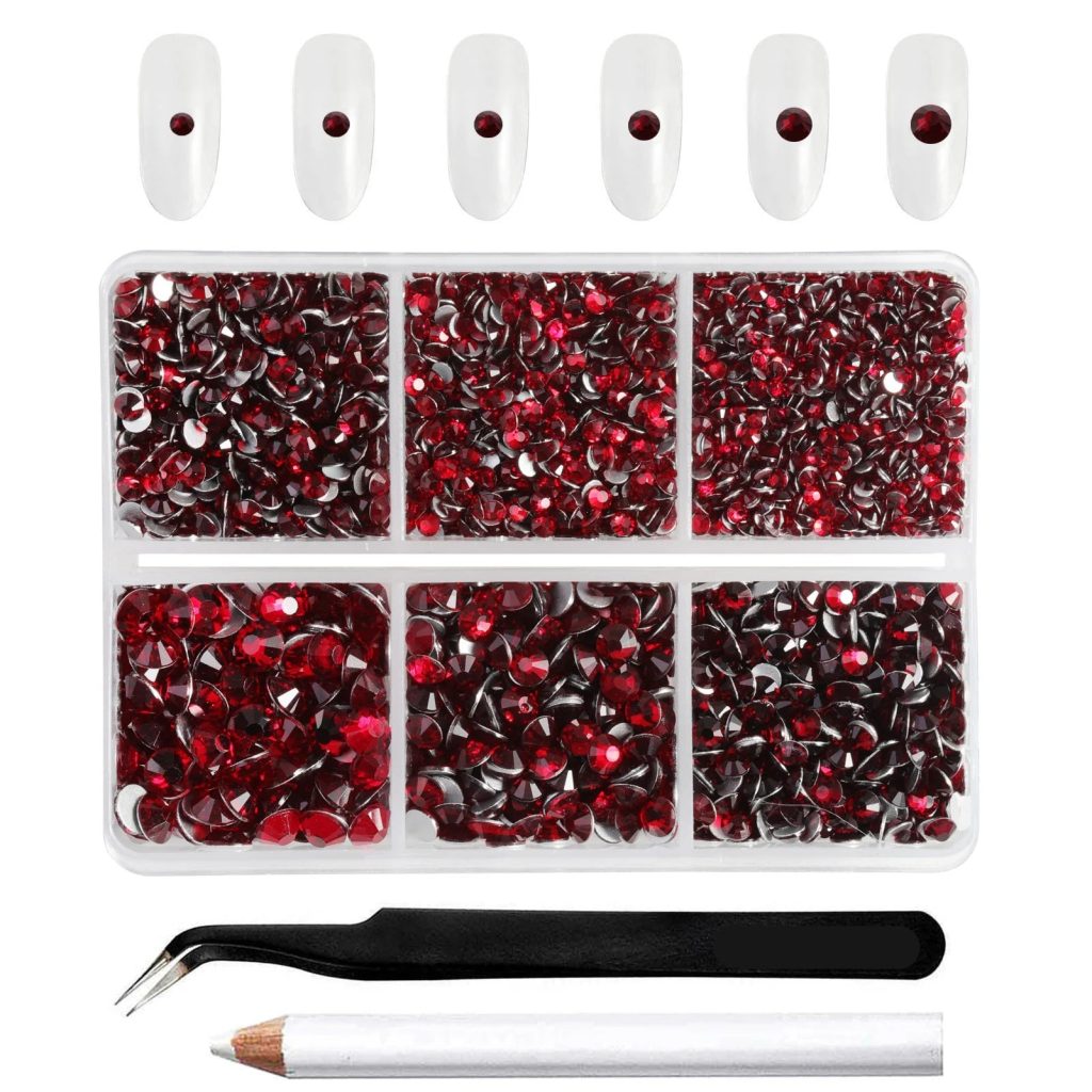 Flatback nail gems in mixed sizes with wax pencil and tweezers